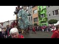 Giant doll from royal de luxe walks among the people in antwerp