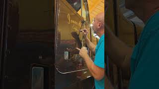 Hand lettering and pinstriping a Peterbilt 359 #trucklettering #signpainting