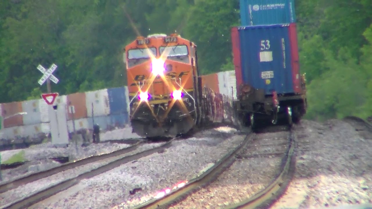 Eastbound BNSF intermodal train meets the westbound empty intermodal ...