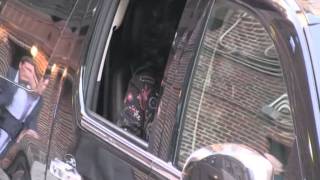 Pop superstar Cher waves and smiles at paparazzi as she escorted out of The Late Sho