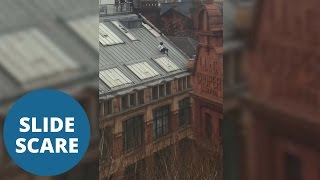 Daredevil Slides Down Roof Of 70Ft High Building