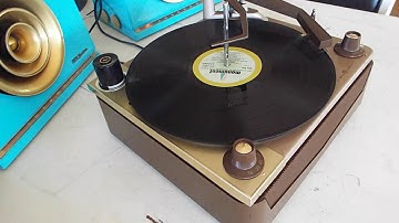 Voice of Music 4 speed automatic record changer playing an LP