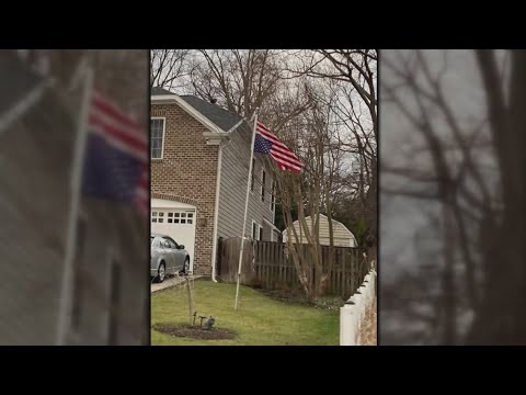 Second flag carried by Jan. 6 rioters displayed outside house owned ...