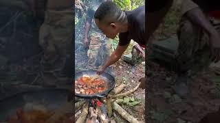 Military men use the snake they killed for stew Wealth
