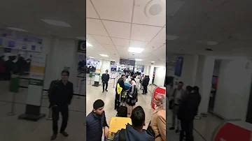 long queue  for boarding at Birmingham Airport