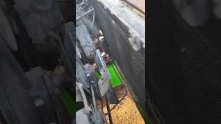 Replacing old radiator in Ford with aluminum radiator.