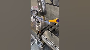 the process of drilling holes in iron using tools to create certain shapes