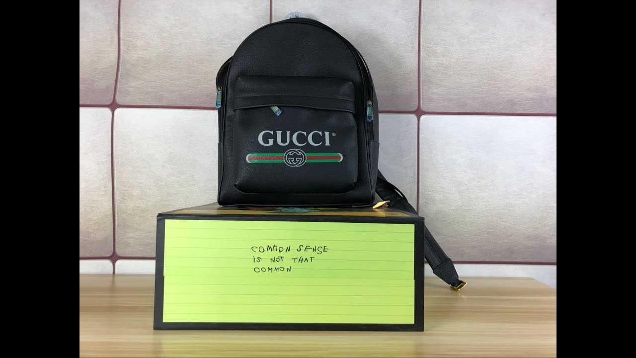 gucci print leather backpack