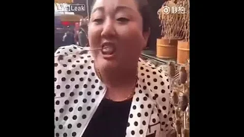 Woman eating live scorpions