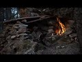 Emergency underground Bunker building with stones and wood.Hardwork.Special fireplace kamin