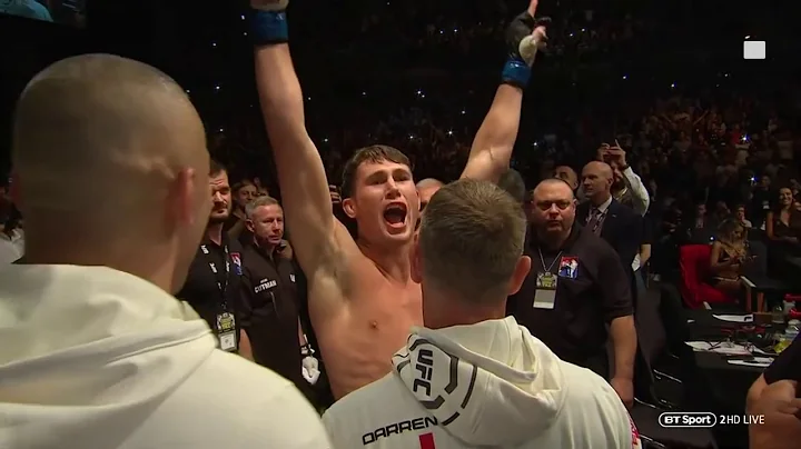 Incredible atmosphere! Darren Till walks out to Sw...