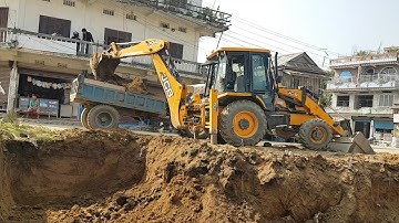JCB Machine Digging Field For Home Construction - JCB Backhoe Machine Loading Mud in Tractor