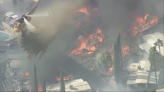 Wind-driven fires threaten California homes