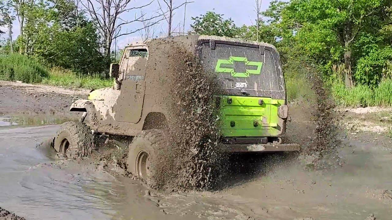 V8 Swapped Jeep Tears Through Mud Pit!  