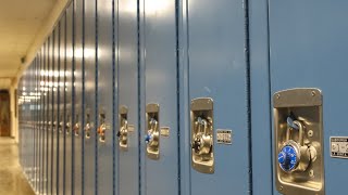 Community packs school board meeting over proposed teacher cuts