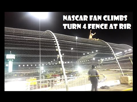 Drunk Nascar Fan Climbs Turn 4 fence at RIR 2014