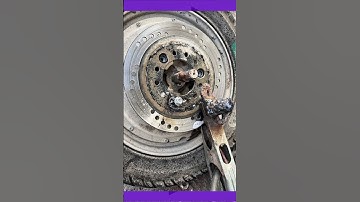 Loosening rusty bolts on an old brake disc with the right tools #mechanic #autoservice