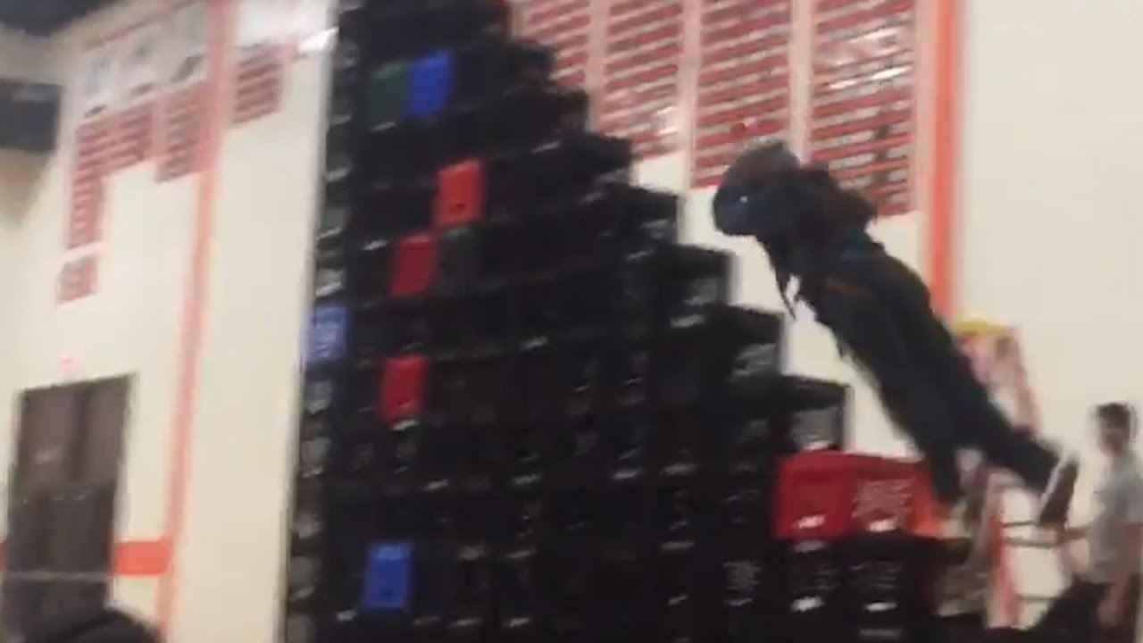 girl is pulled head first into a stack of crates what s trending
