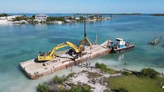 Piling the Dock by Barge