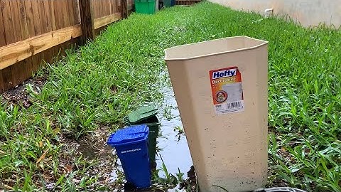 Trash Day With Mini Bins In The Rain