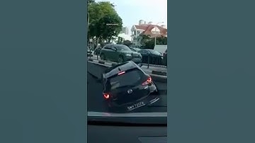 Shocking moment car disappears into giant sinkhole