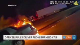 Officer pulls driver from burning car