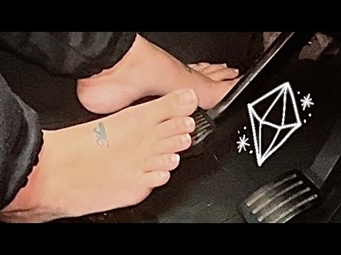 Girl driving with bare feet and natural toe nails