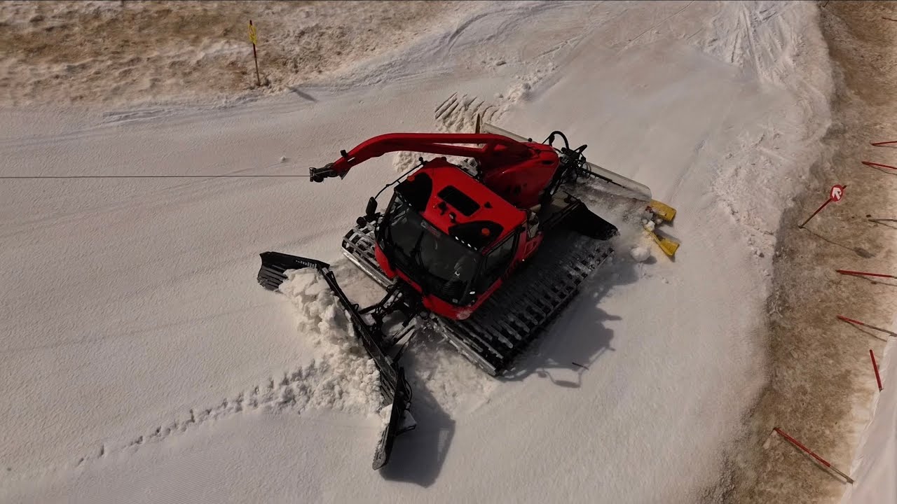 Snowcat Levelling On Glacier (Birds Eye Perspective)
