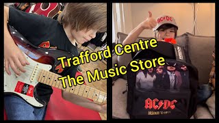 Music merchandise/ Trafford Centre/ trying an American Fender/ AC/DC