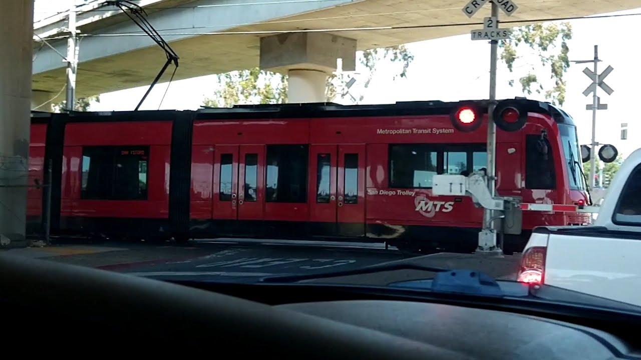 Trolleys crossing paths under the freeway YouTube