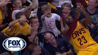 LeBron James uses fan's phone to take an awesome selfie at Cavs preseason game screenshot 2