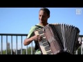 Romanian busker is playing live music on accordion  katyusha paris france