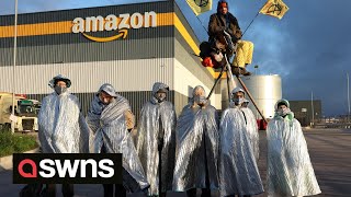 Extinction Rebellion (XR) activists block Amazon depots across the UK during Black Friday | SWNS