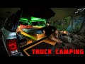 Truck Camping In Rain With Campfire And Tarp Shelter