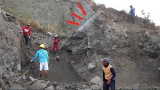 The large rock on the cliff has cracked.