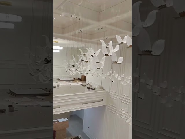 A flock in motion, suspended in light