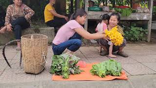 The girl harvests vegetables to sell at the market and weeds the garden