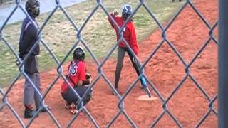 Danielle Turner hitting a a fly ball between left and center. screenshot 2