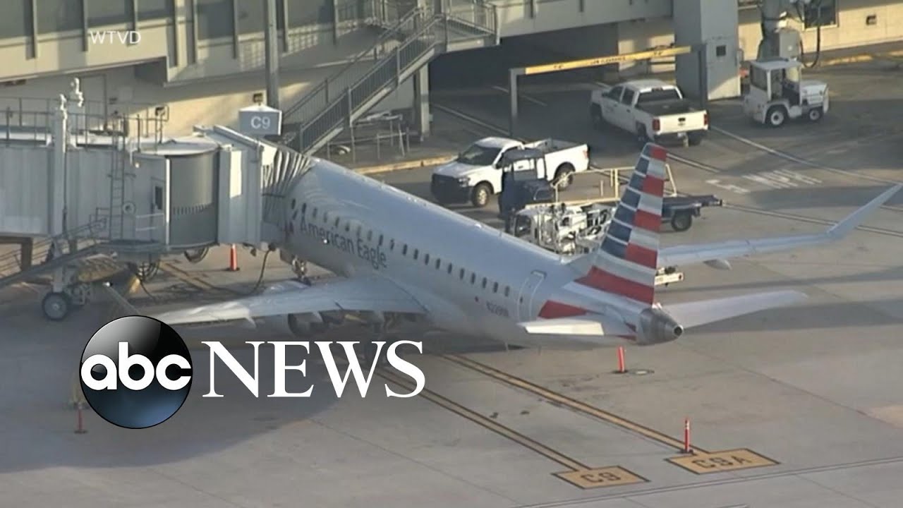 The flight makes an emergency landing after an unruly passenger tries to breach the cabin