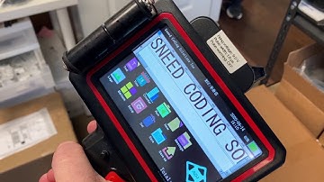 Sneed Jet One Inch Handheld Printer on Cardboard & Wood