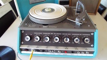 NEWCOMB 4 speed manual record player playing a 78 RPM record.