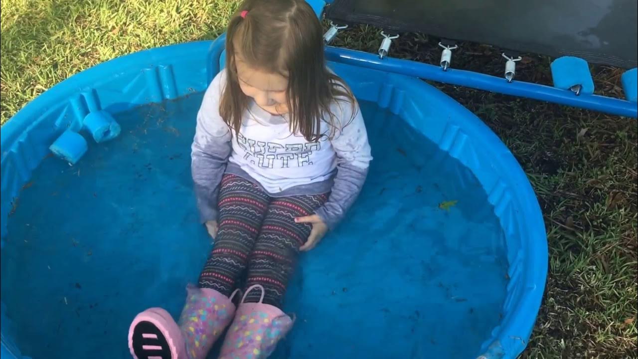 Jumps in the kiddie pool with her clothes on. YouTube