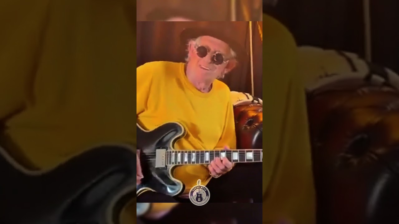 Keef chill with his guitar backstage 