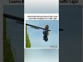 Motorcyclist Seriously Injured After Crash Leaves Bike Dangling From Traffic Light 🤔🤔#shorts