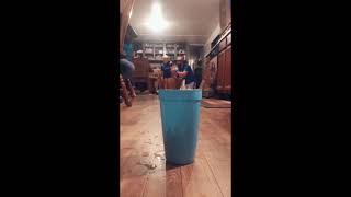 Man And Boy Throw Pencils Into Cup