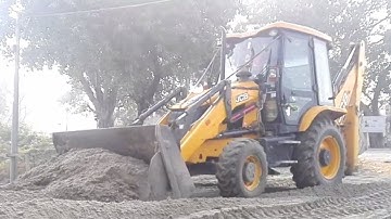JCB Backhoe Levelling Soil For House Foundation