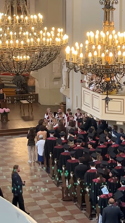 Wind orchestra performing Gaudeamus igitur during graduation ceremony