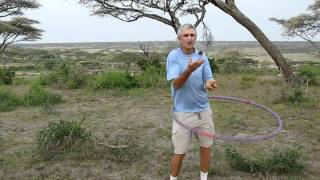 Michael Ellis hooping while juggling dung beetle balls
