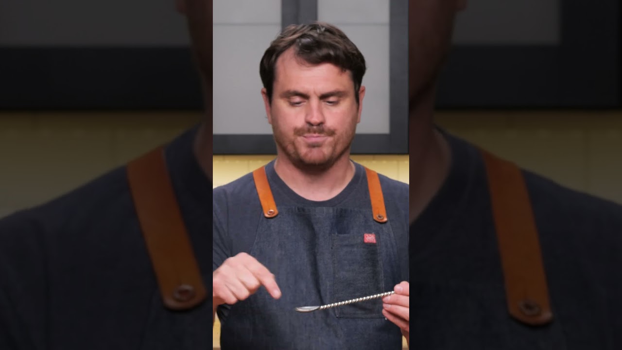 Bartender teaches how to use a barspoon correctly