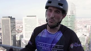 French athlete climbs 140-meter-tall tower on his bike